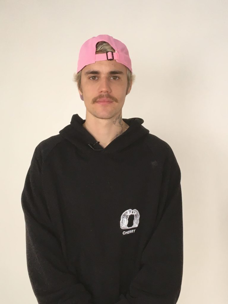 Justin in pink baseball cap.